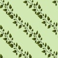 Vector seamless pattern with diagonal green foliate twigs.